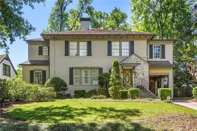 front view of a house with a yard