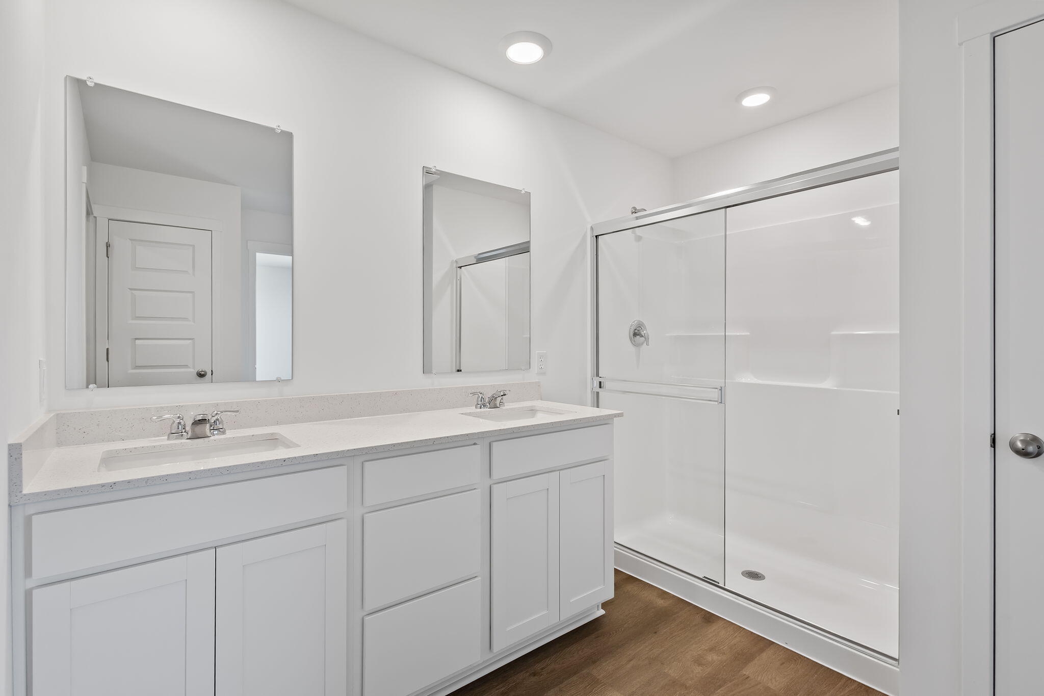 10669 Blaine Street Crown Point, IN 46307 - Photo 17 of 27 a bathroom with double sink and a mirror