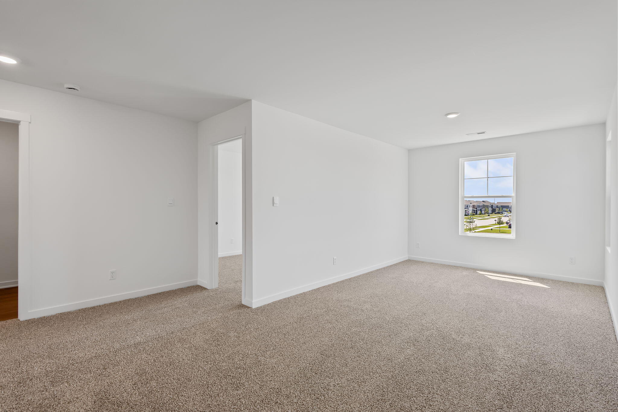 10669 Blaine Street Crown Point, IN 46307 - Photo 19 of 27 a view of an empty room with a window