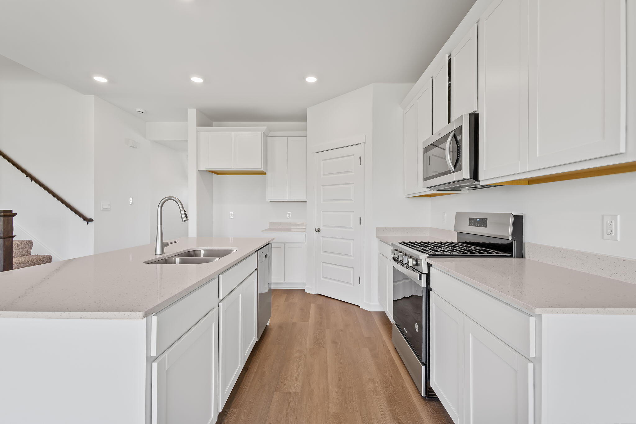 10669 Blaine Street Crown Point, IN 46307 - Photo 2 of 27 a kitchen with stainless steel appliances granite countertop a sink stove and cabinets