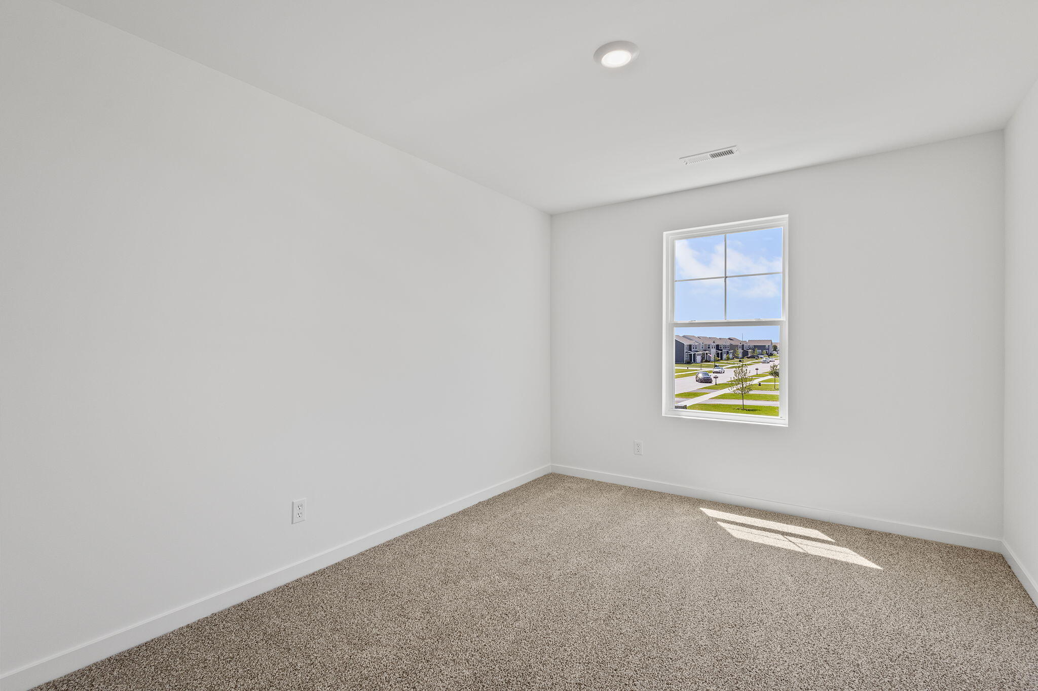 10669 Blaine Street Crown Point, IN 46307 - Photo 21 of 27 a view of an empty room and a window