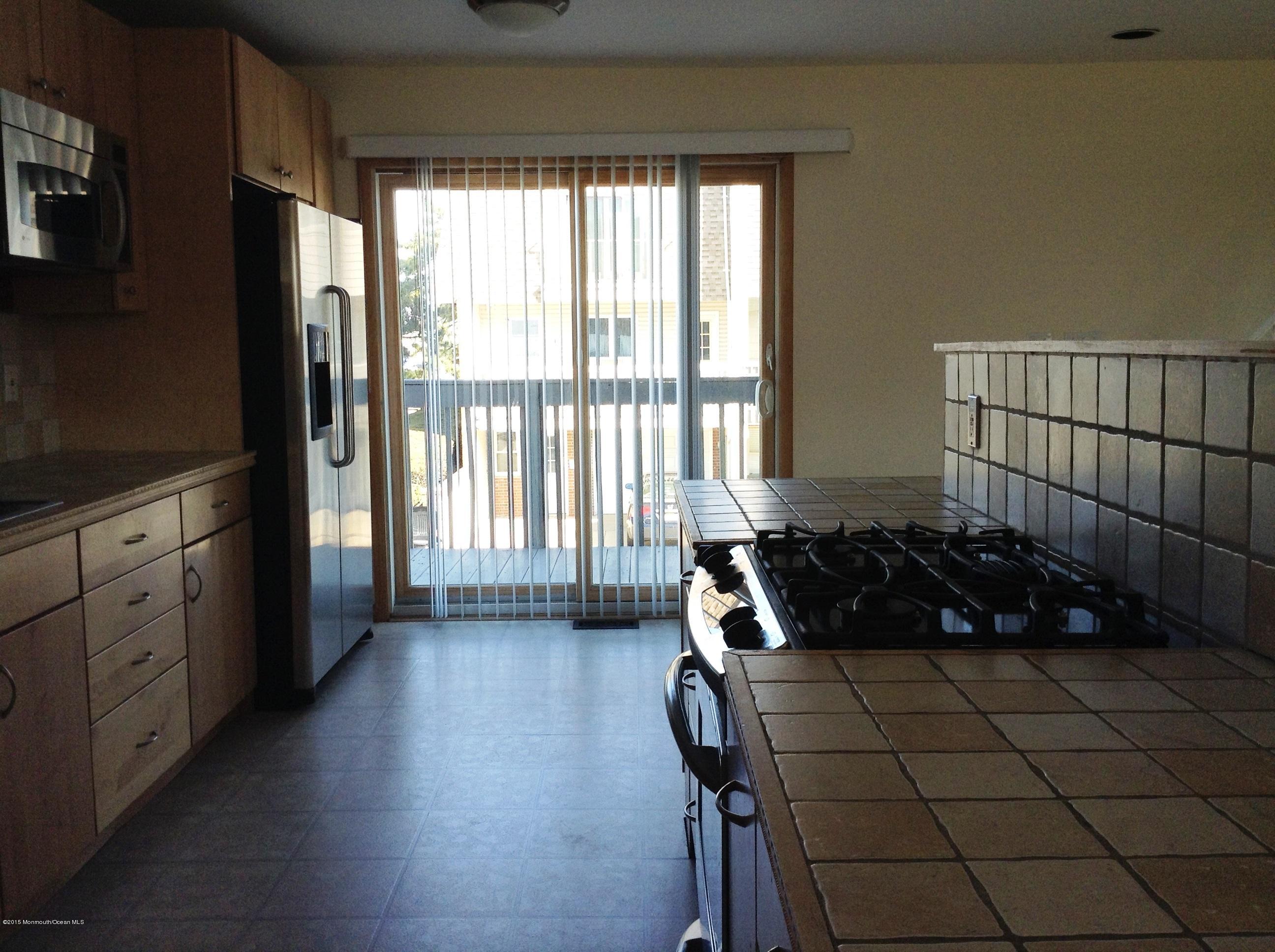 50 Village Road, Unit 50 Sea Bright, NJ 07760 - Photo 9 of 24 Kitchen with Slider