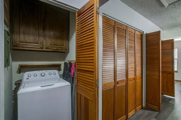 a view of a patio with a table and chairs