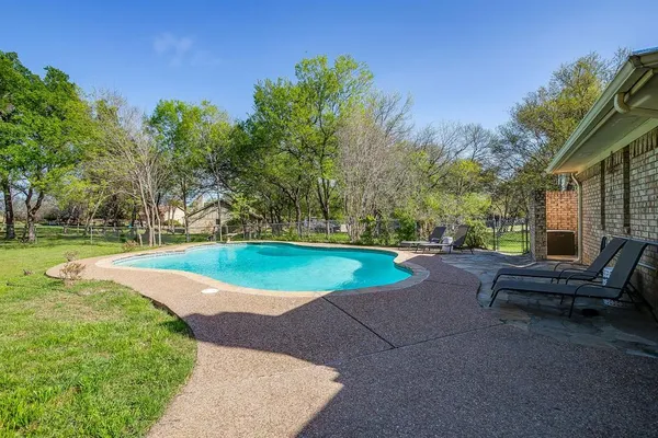 a large tree in front of a house