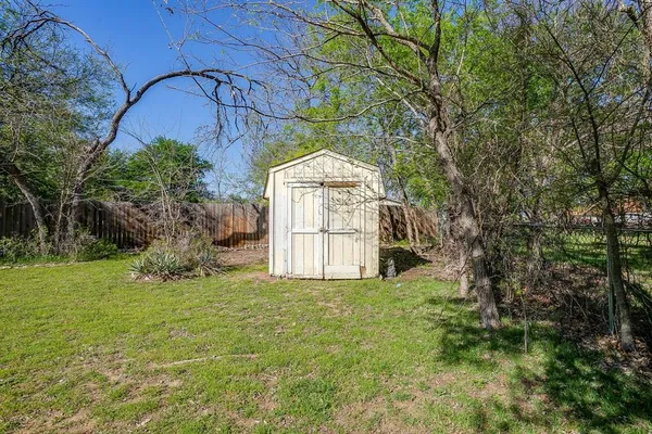 a view of a patio with chairs and table in a patio