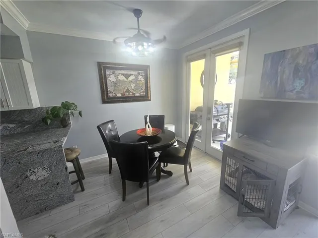 a bathroom with a toilet sink vanity and mirror