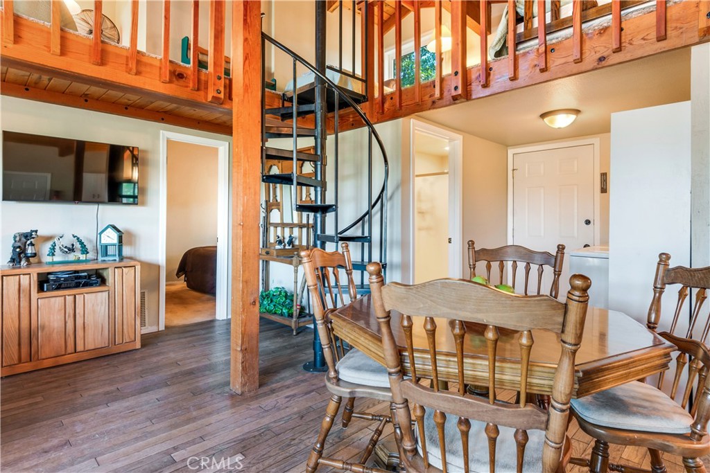 39576 Oakglen Road Fawnskin, CA 92333 - Photo 13 of 30 a view of a dining room with furniture and wooden floor