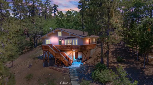 a house that has tree in front of it