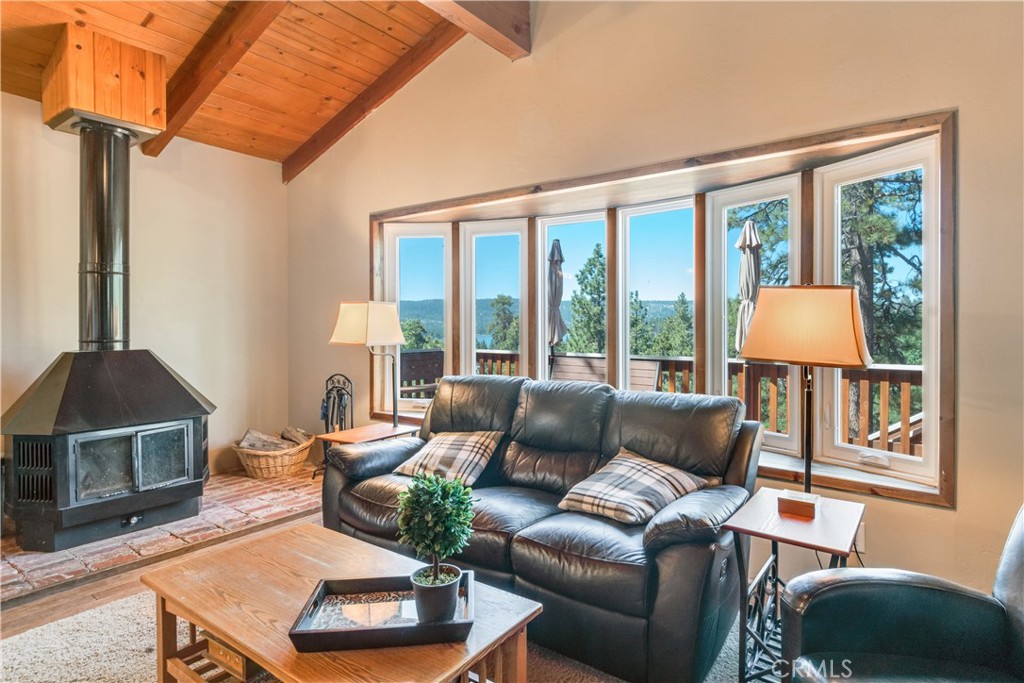 39576 Oakglen Road Fawnskin, CA 92333 - Photo 8 of 30 a living room with furniture and a window