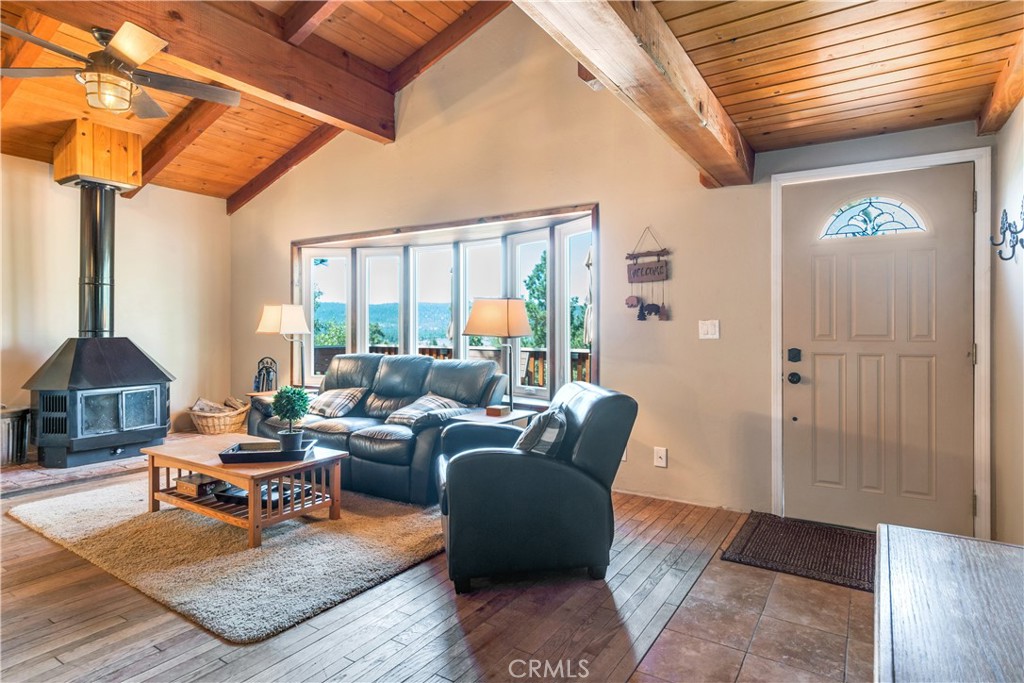 39576 Oakglen Road Fawnskin, CA 92333 - Photo 10 of 30 a living room with furniture and a window