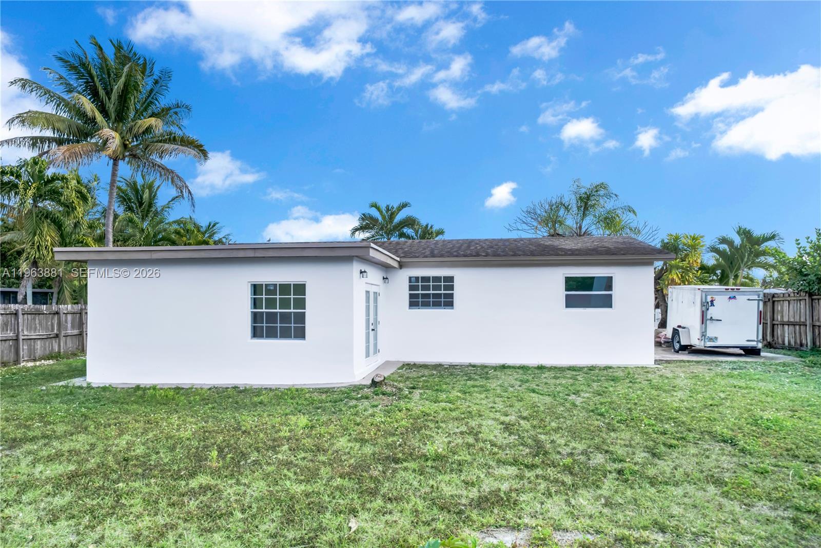 29822 Southwest 149th Avenue Homestead, FL 33033 - Photo 16 of 17 a house with a tree in front of it