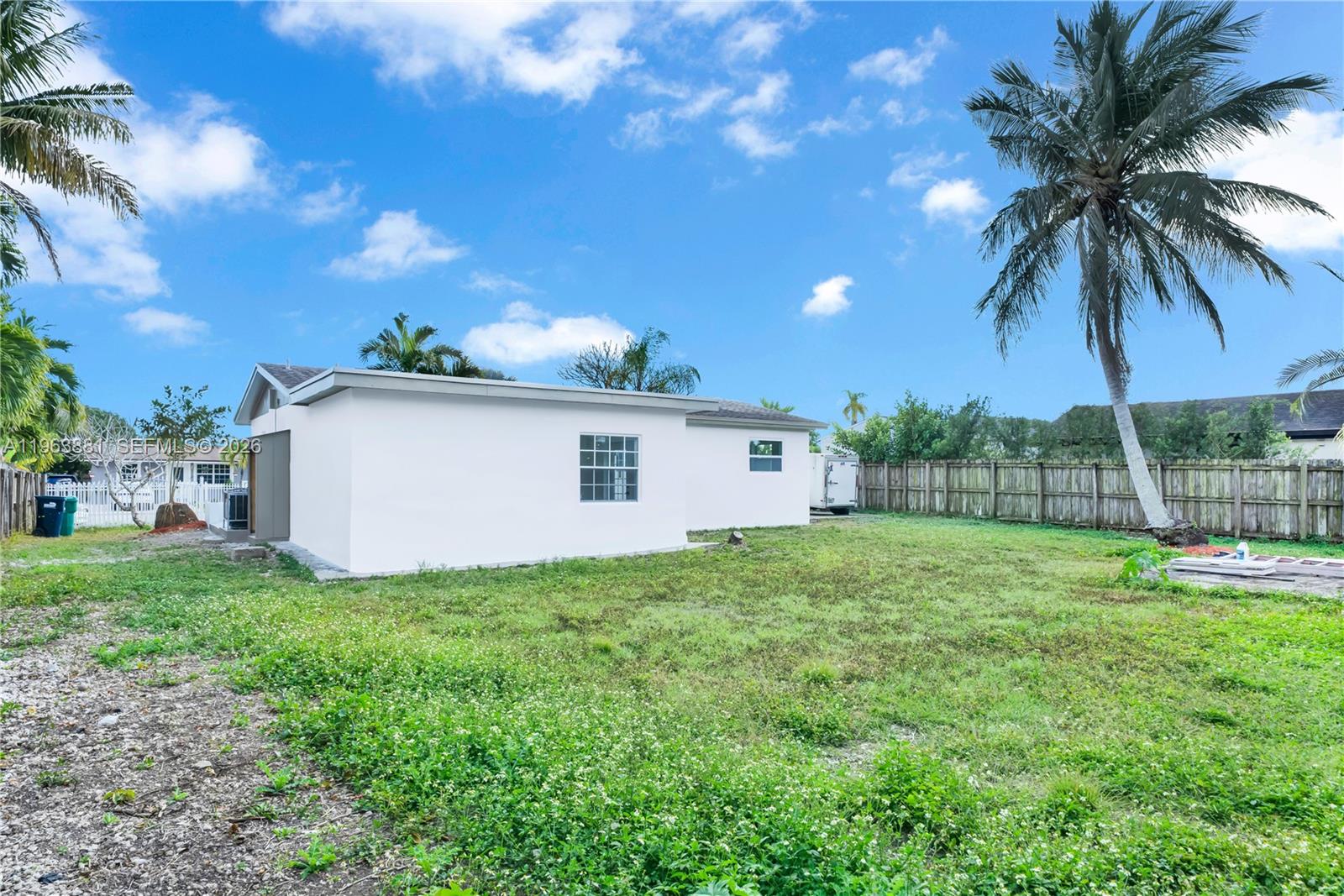 29822 Southwest 149th Avenue Homestead, FL 33033 - Photo 17 of 17 a view of a backyard with a garden