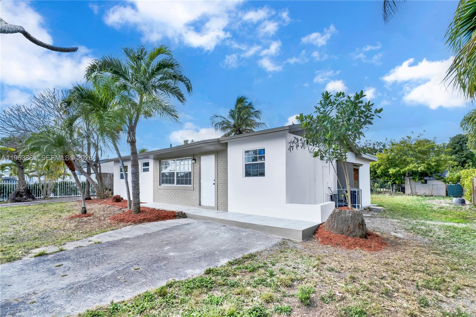29822 Southwest 149th Avenue Homestead, FL 33033 - Photo 2 of 17 a front view of a house with porch