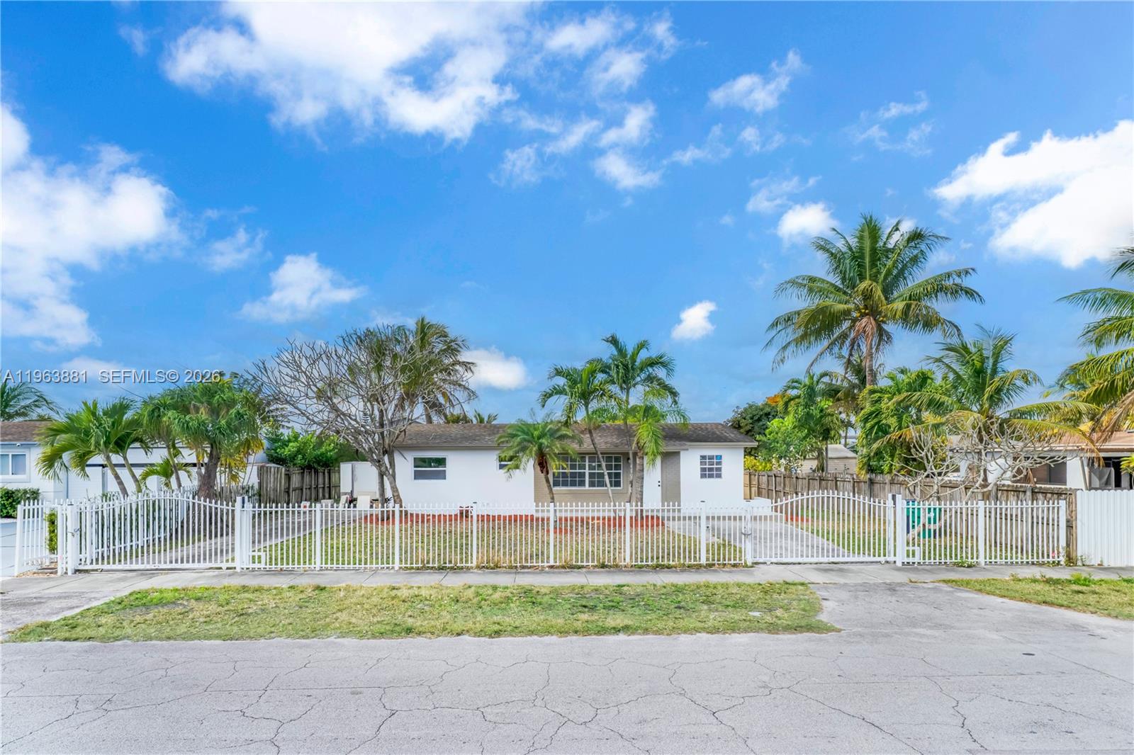 29822 Southwest 149th Avenue Homestead, FL 33033 - Photo 4 of 17 a house with a garden in front of it