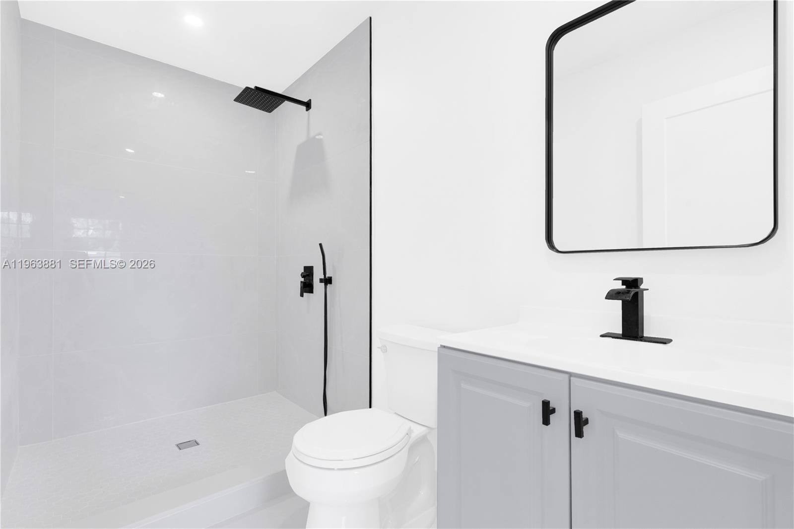 29822 Southwest 149th Avenue Homestead, FL 33033 - Photo 10 of 17 a bathroom with a shower a toilet and a sink