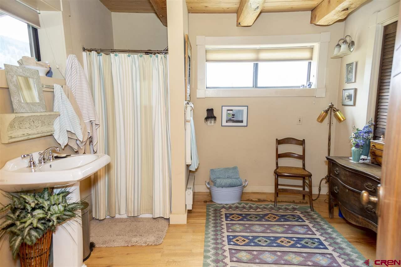 148 Rio Grande Drive Creede, CO 81130 - Photo 11 of 27 a bathroom with a sink and a mirror