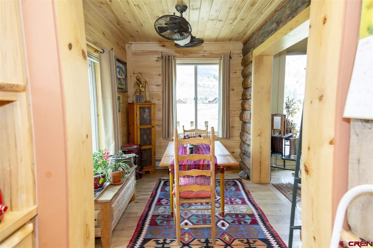 148 Rio Grande Drive Creede, CO 81130 - Photo 13 of 27 a very nice looking room with many windows