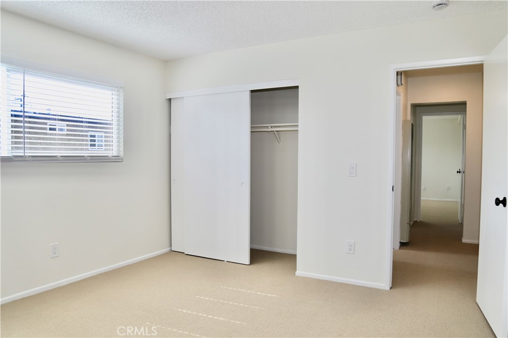 16702 Blanton Lane Huntington Beach, CA 92649 - Photo 11 of 19 an empty room with windows and closet