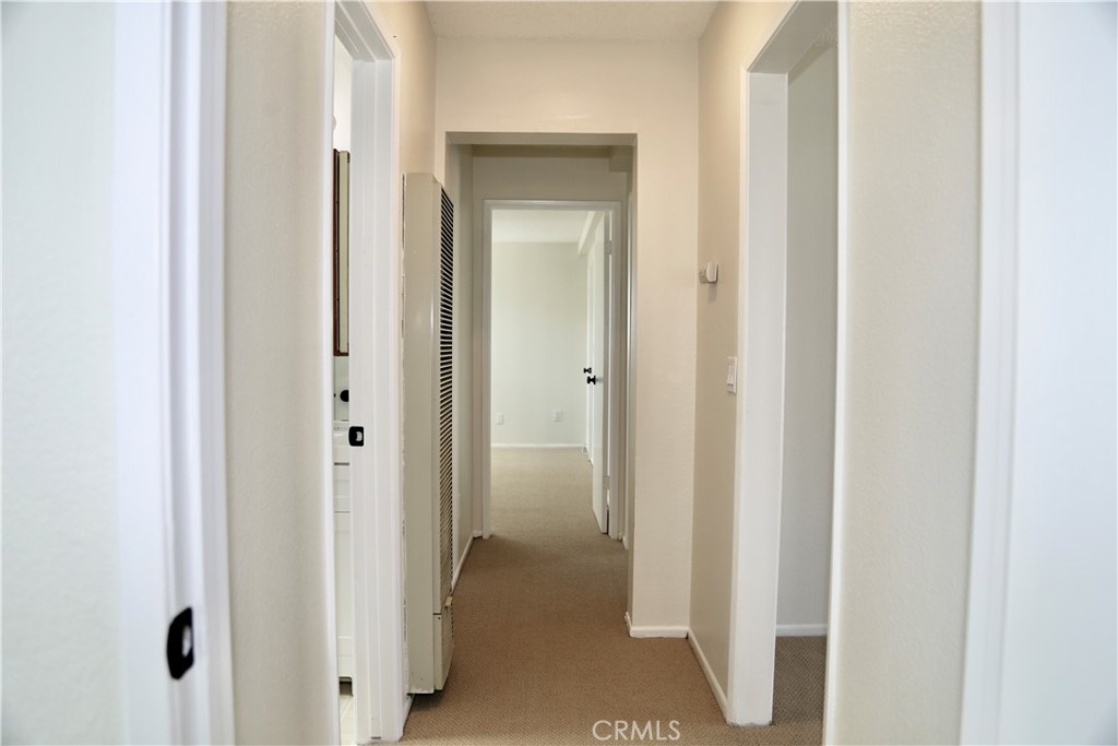 16702 Blanton Lane Huntington Beach, CA 92649 - Photo 12 of 19 a view of a bathroom from a hallway