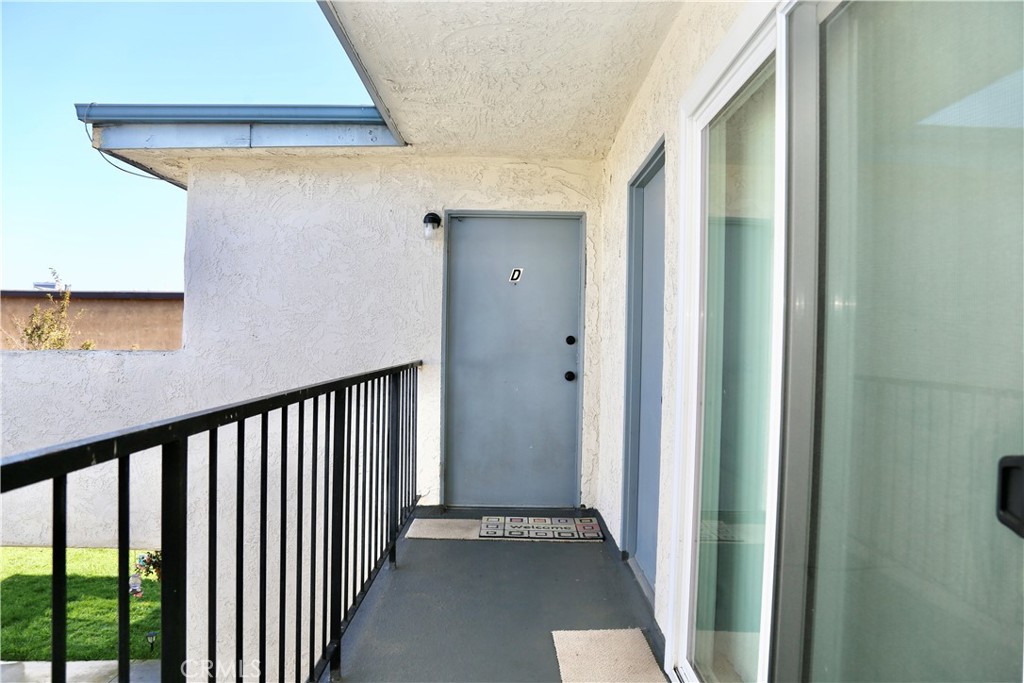 16702 Blanton Lane Huntington Beach, CA 92649 - Photo 18 of 19 a view of a hallway with wooden floor and entryway