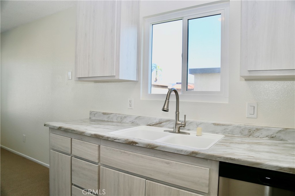 16702 Blanton Lane Huntington Beach, CA 92649 - Photo 4 of 19 a bathroom with a sink and cabinets