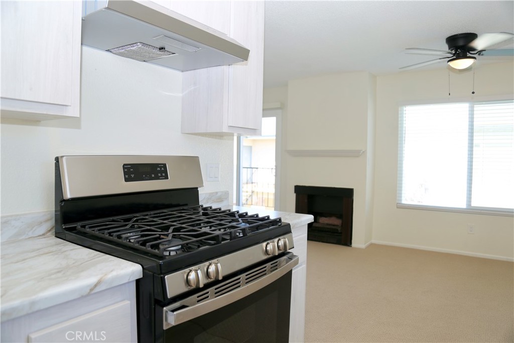 16702 Blanton Lane Huntington Beach, CA 92649 - Photo 5 of 19 a stove top oven sitting inside of a kitchen