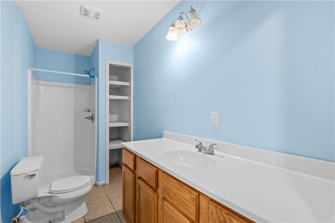 636 South County Road 1150 Riviera, TX 78379 - Photo 11 of 20 a bathroom with a sink a toilet and shower