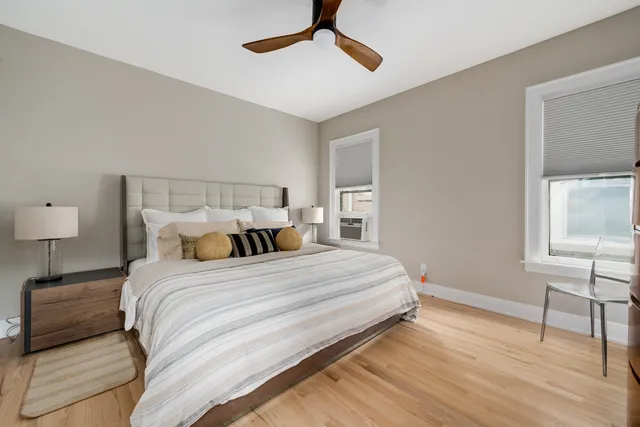 a bedroom with a bed and a lamp