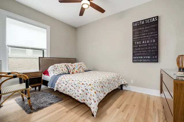 a bedroom with a bed and a table in it