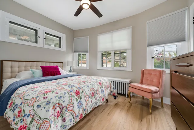 a bedroom with a bed and a couch