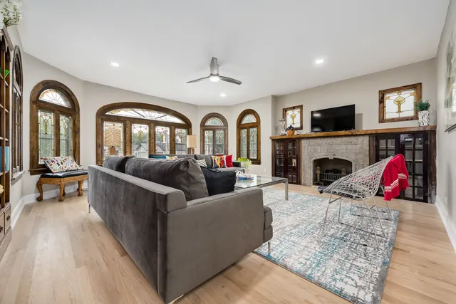a living room with furniture fireplace and flat screen tv