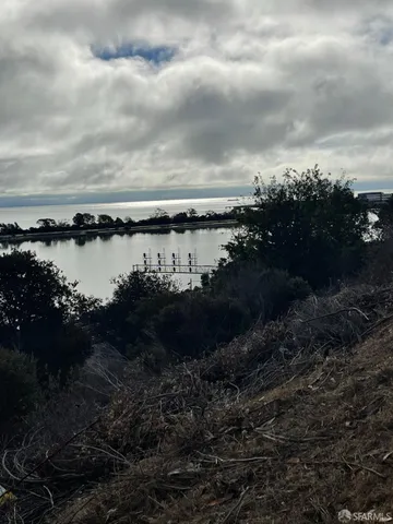 a view of an ocean and a mountain