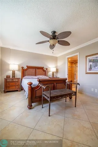a living room with furniture a ceiling fan and a window