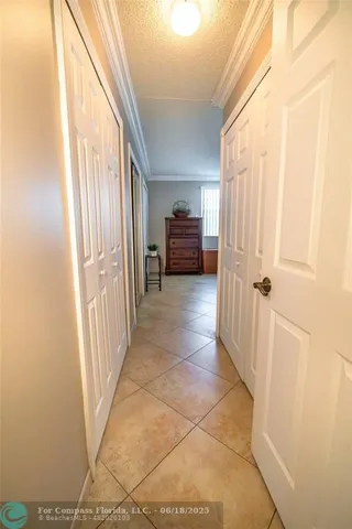 a view of a hallway view with staircase