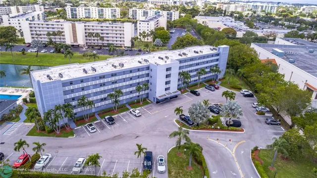 an aerial view of a house with a garden and outdoor space