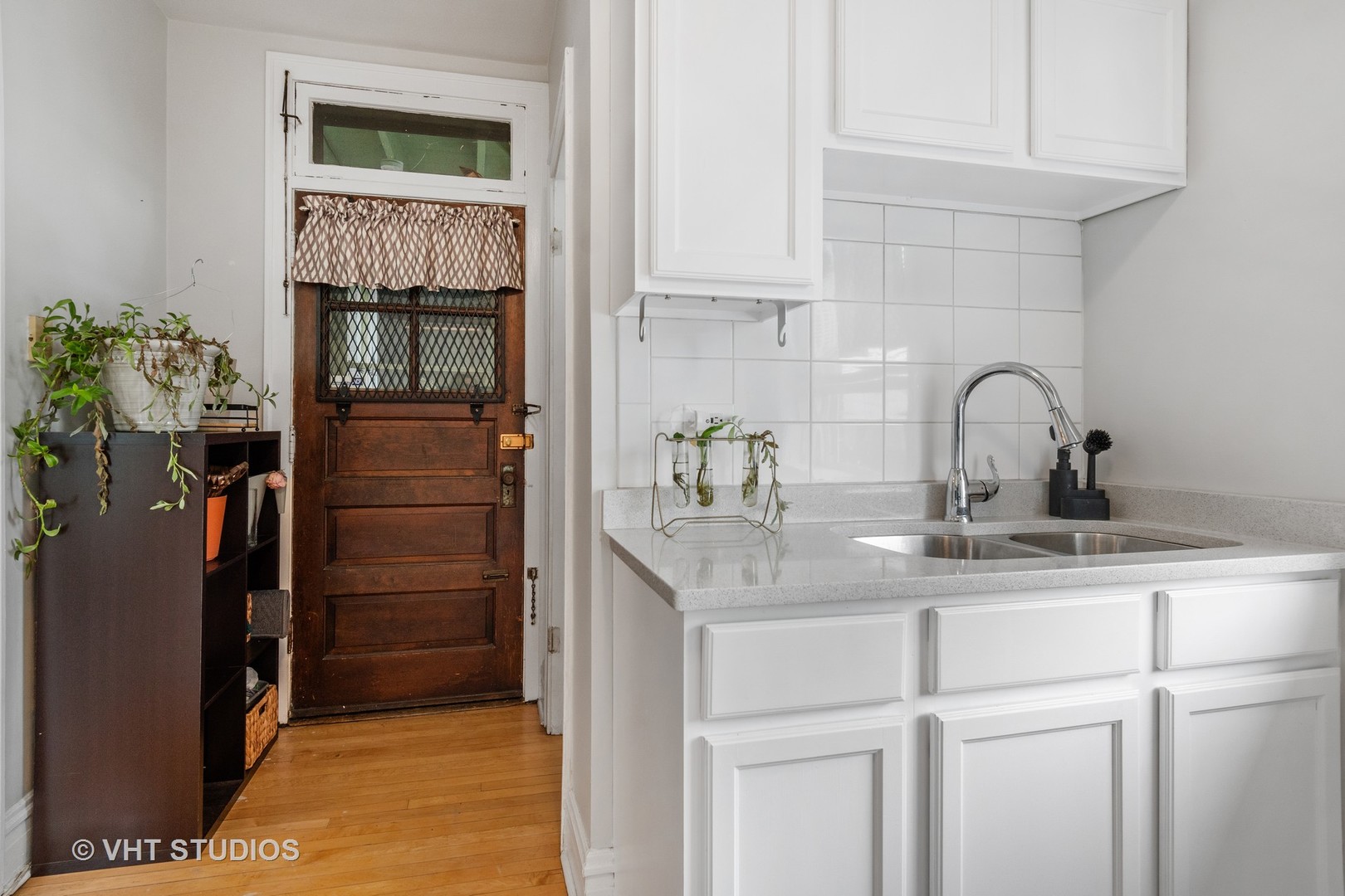 7 Fillmore Street, Unit 2 Oak Park, IL 60304 - Photo 18 of 27 a kitchen with a sink and a refrigerator