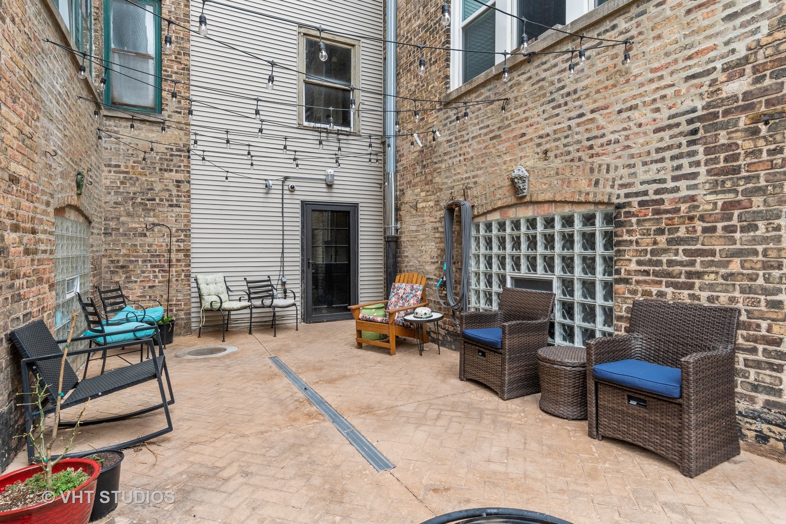 7 Fillmore Street, Unit 2 Oak Park, IL 60304 - Photo 27 of 27 a view of a patio with couches and a fireplace
