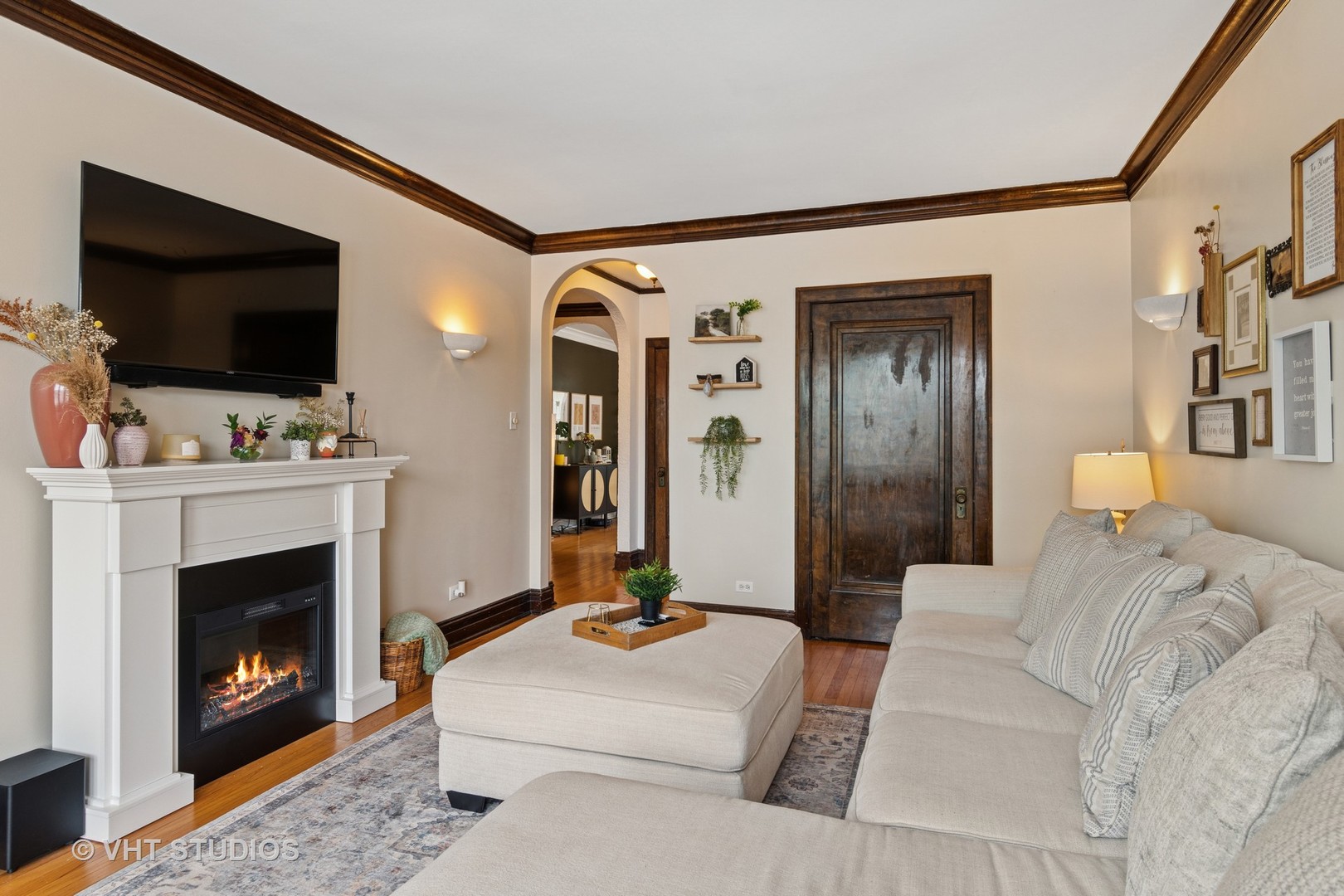 7 Fillmore Street, Unit 2 Oak Park, IL 60304 - Photo 7 of 27 a living room with furniture a flat screen tv and a fireplace