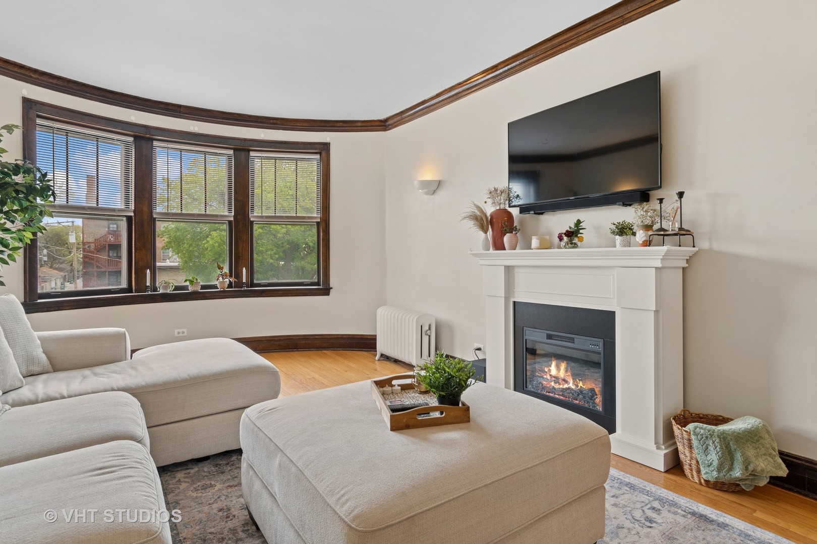 7 Fillmore Street, Unit 2 Oak Park, IL 60304 - Photo 9 of 27 a living room with furniture a flat screen tv and a fireplace
