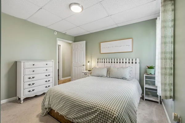 a bedroom with a bed and a cabinets