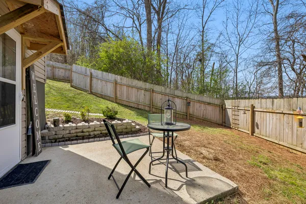 a view of balcony with wooden floor and outdoor seating