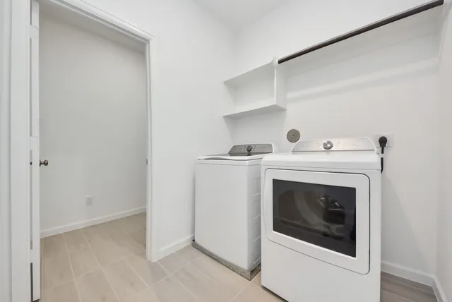 a bedroom with a bed and a desk