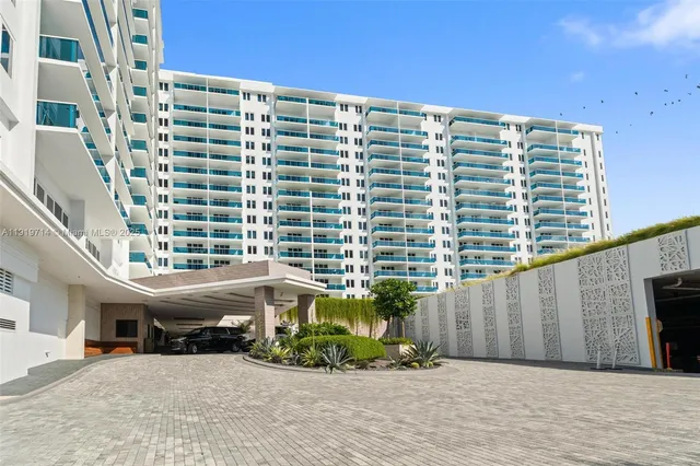 a front view of a building with garden