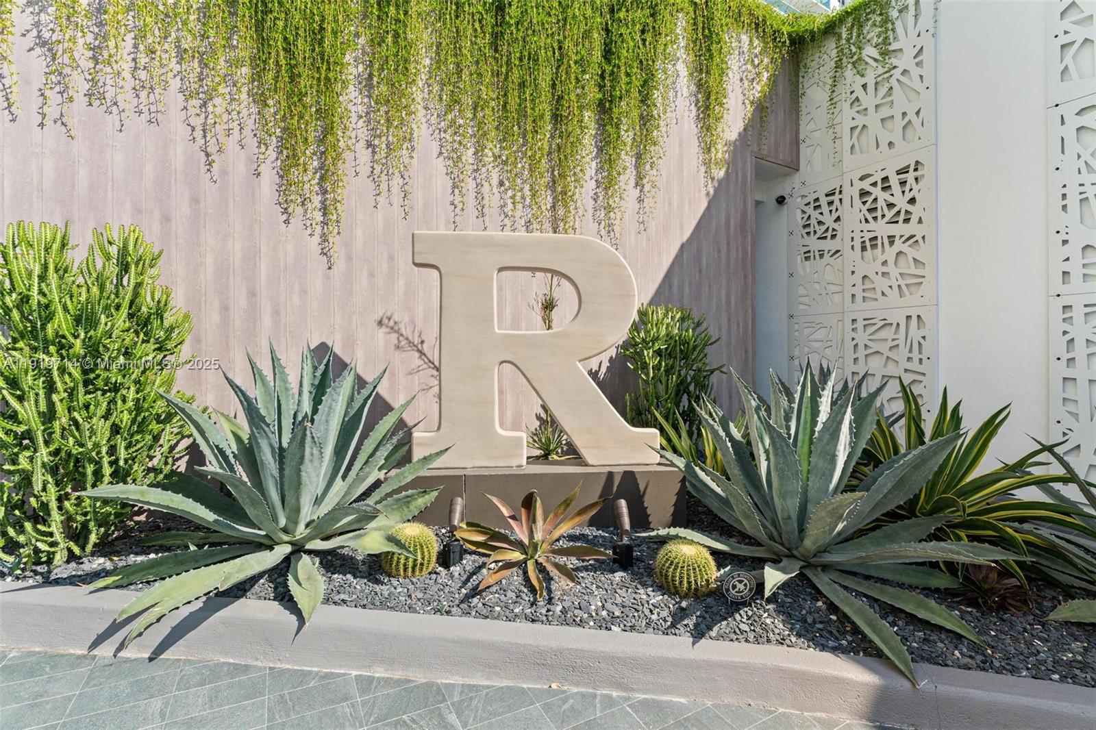 2301 Collins Avenue, Unit 802 Miami Beach, FL 33139 - Photo 2 of 26 a potted plant sitting in front of a building
