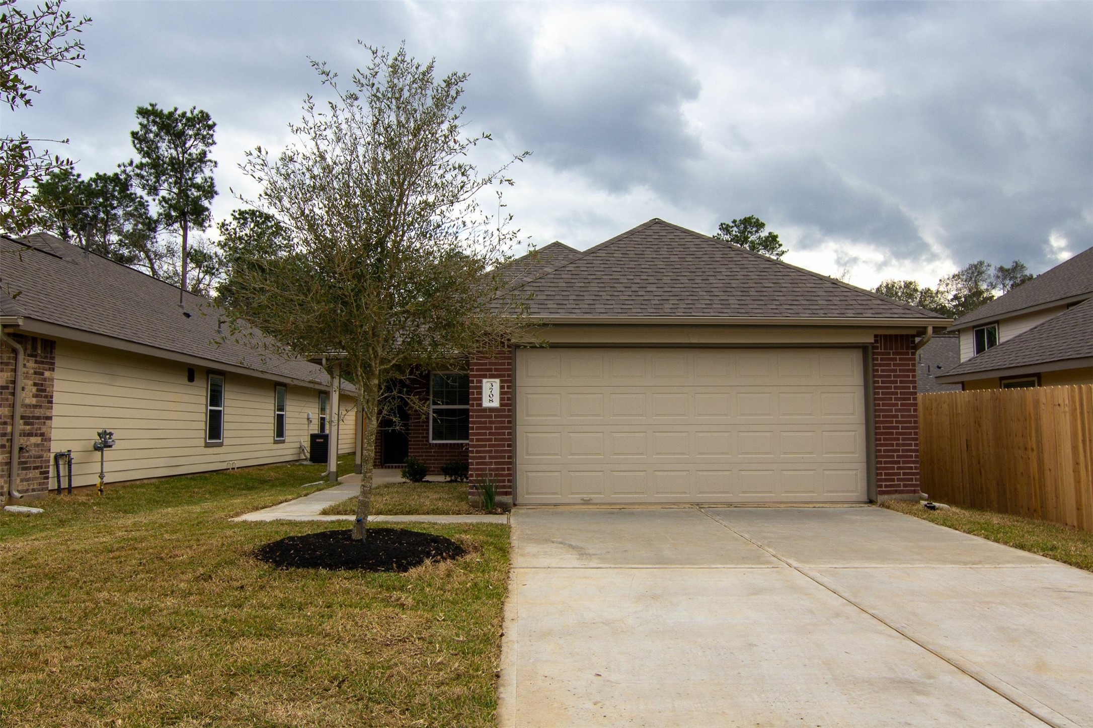 3708 Alexus Drive Conroe, TX 77301 - Photo 1 of 20 a house view with a garden space