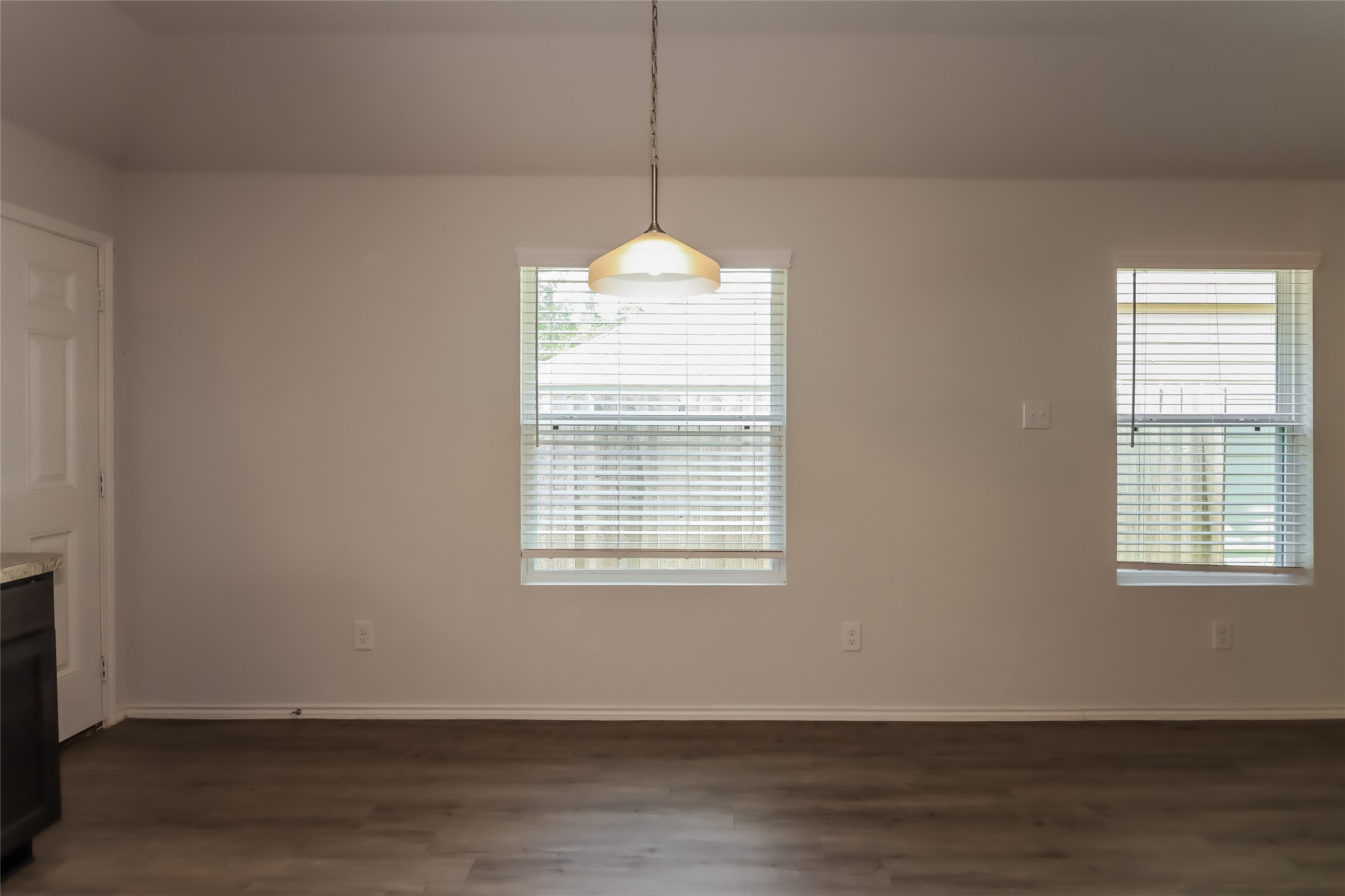 3708 Alexus Drive Conroe, TX 77301 - Photo 9 of 20 a view of an empty room with wooden floor and a window