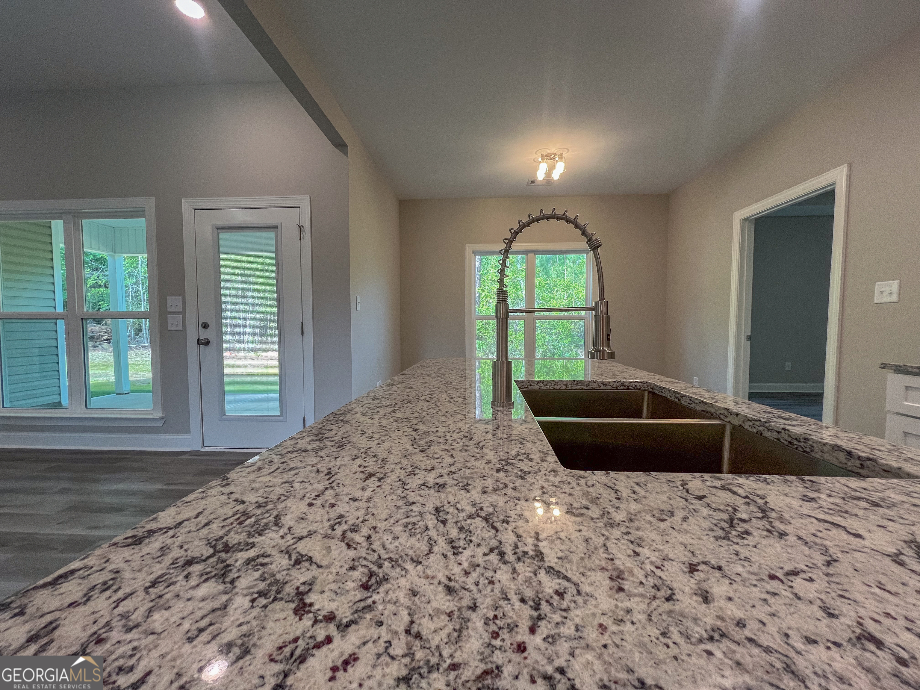 711 Flanders Lane Dublin, GA 31021 - Photo 13 of 49 a bedroom with a bed and a large window