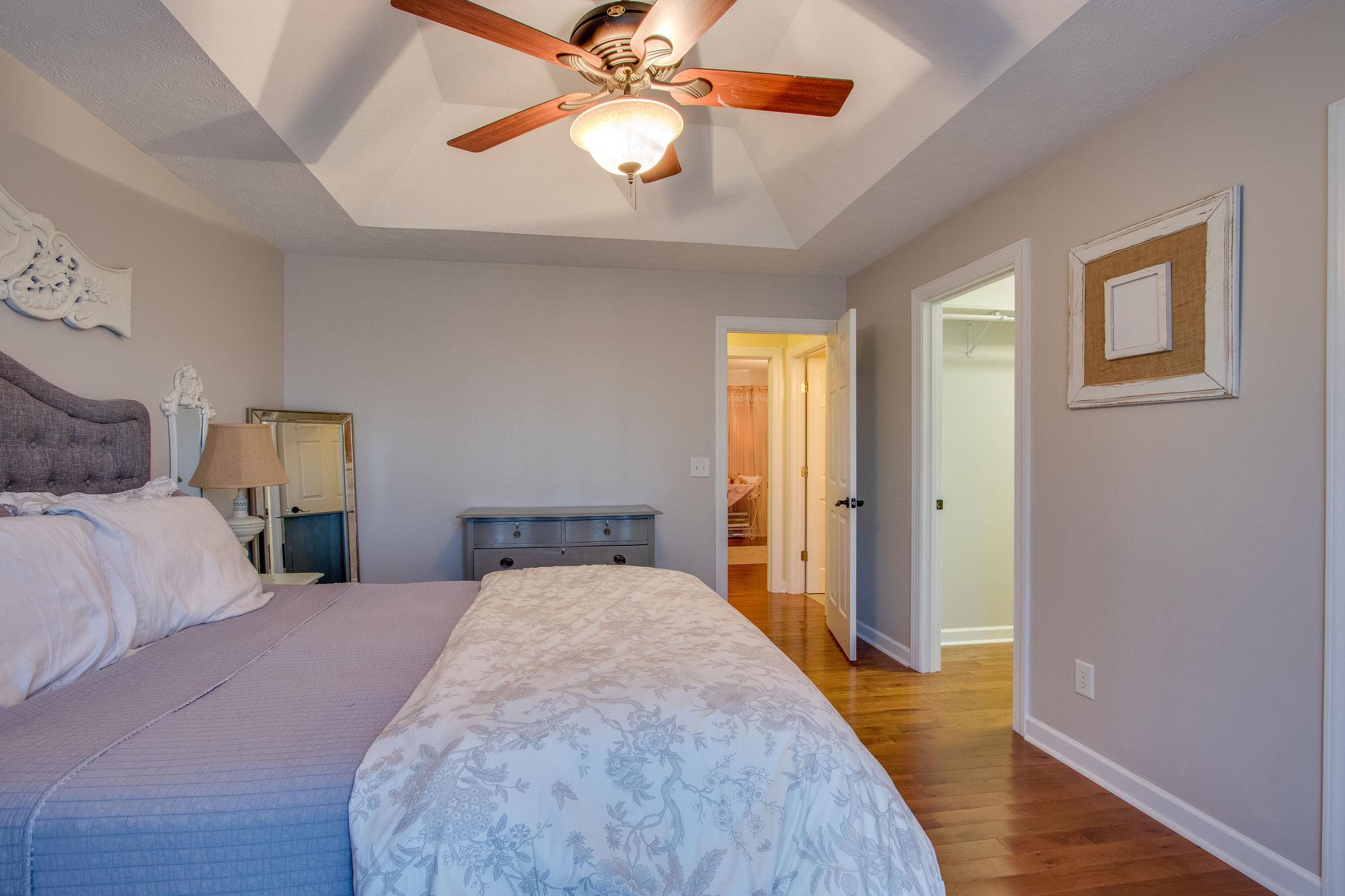 2181 Berea Church Road Lebanon, TN 37087 - Photo 14 of 28 a bedroom with a bed and a chandelier