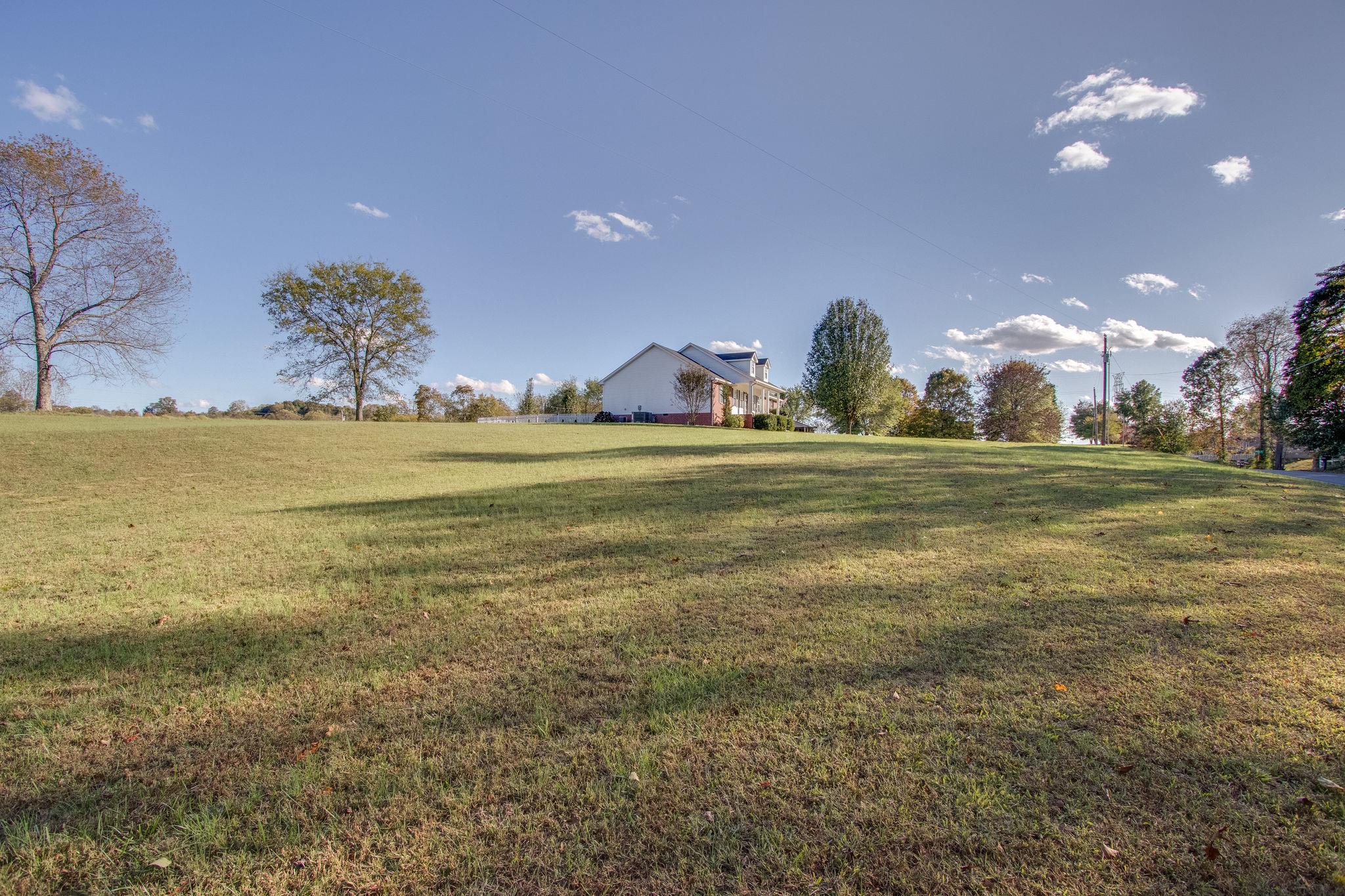 2181 Berea Church Road Lebanon, TN 37087 - Photo 27 of 28 a view of a big room with a big yard and a large tree