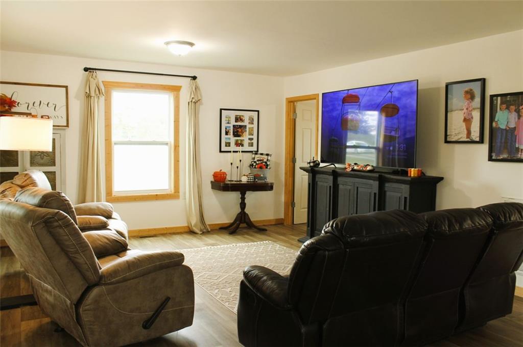 765 Addison Road Buchanan, GA 30113 - Photo 12 of 34 a living room with furniture and a flat screen tv